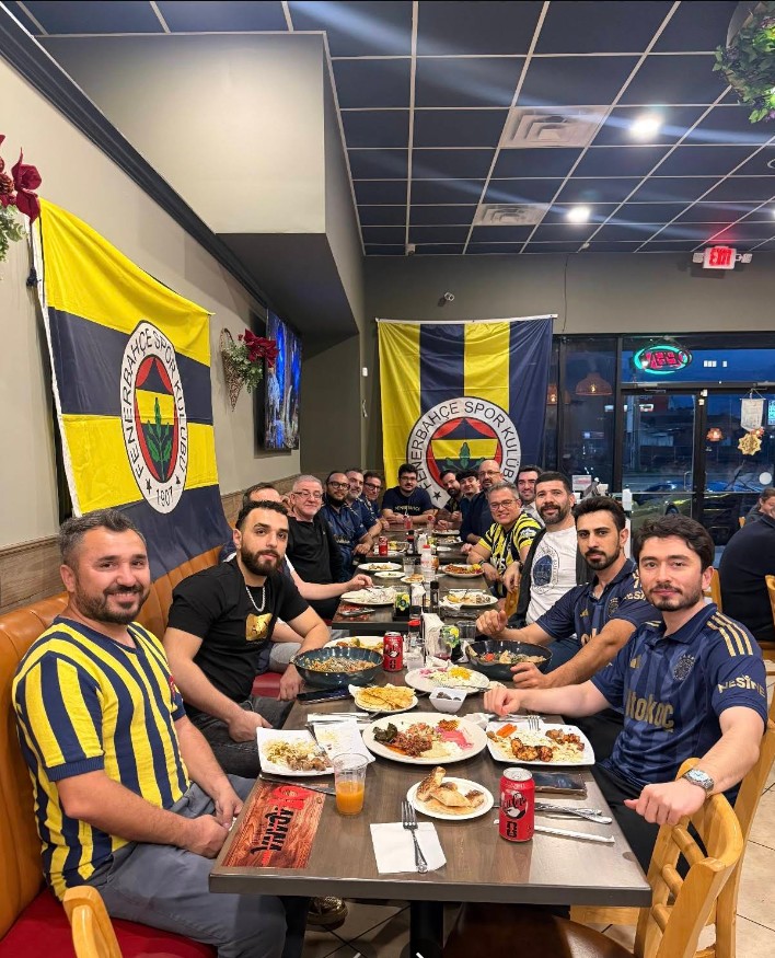 Guests enjoying a lively evening of Turkish food and football at the restaurant